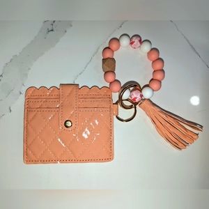 Coral colour ladies wristlet. Elastic band. Jumbo beaded card holder.new
